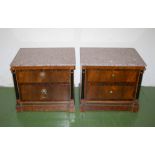 A pair of marble top bedside cabinets