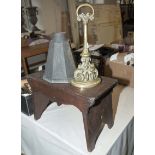 A vintage oak stool, brass doorstop and a water down spout