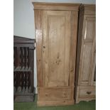 A Victorian single door pine wardrobe