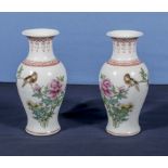 A small pair of Chinese Republic Famille Rose fish tail vases decorated with a bird amongst pink