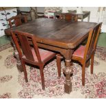 An oak draw leaf table and 4 chairs.