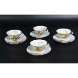 Six Art Deco style cups and saucers
