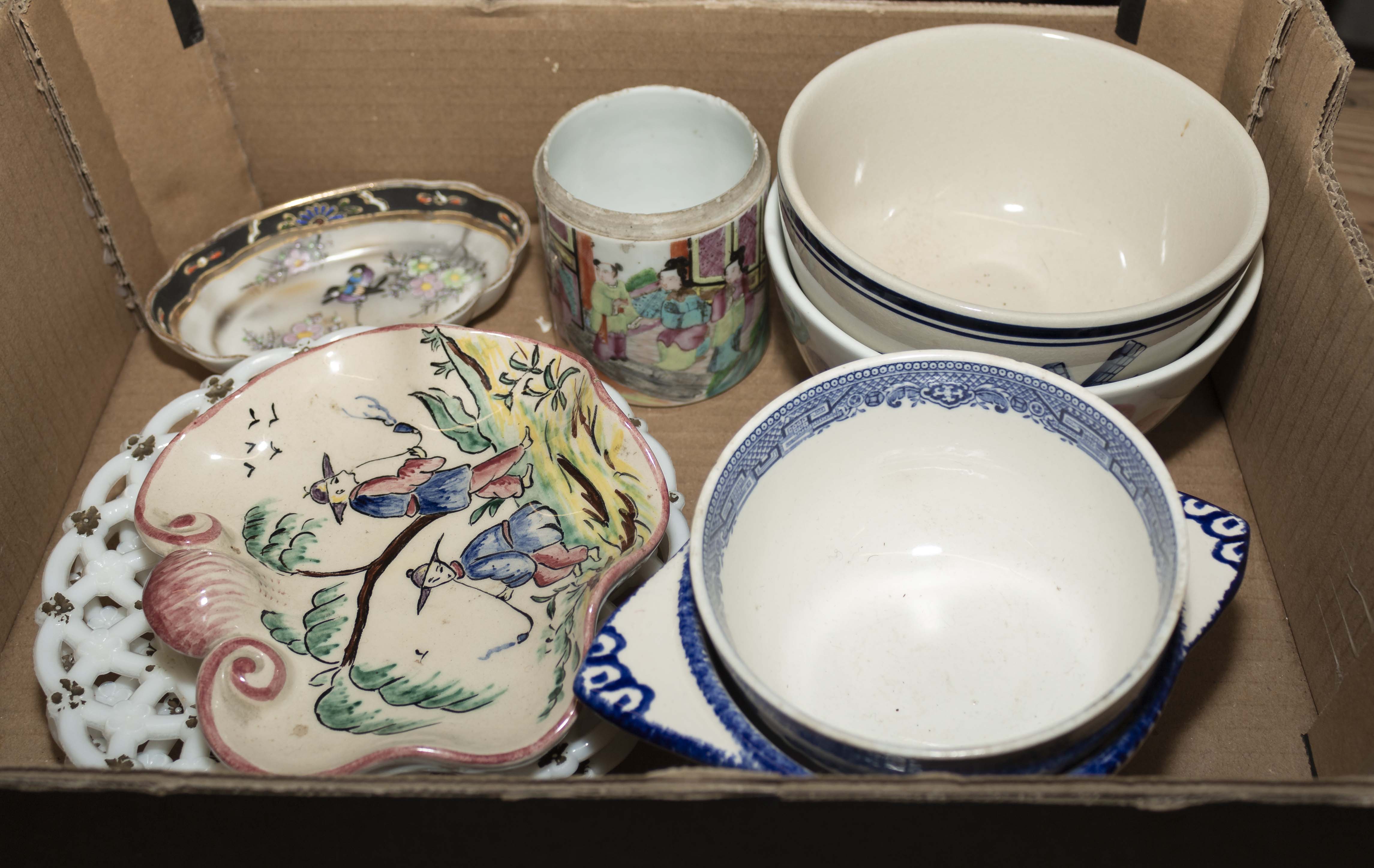 A box containing tureens and other table ware