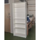 A painted open bookcase