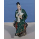 Chinese Republic figure of a man with a fan, marks to base, 8 inches tall