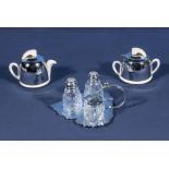 A cruet set and a miniature part tea service