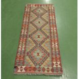 A Chobi Kilim runner, size 153cm x 60cm