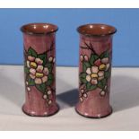 A pair of pink ground vases