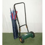 A lawn mower and training pegs