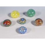 Six glass paper weights