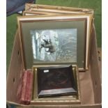 A box containing framed prints