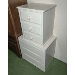 A painted pine bedside cabinet and a set of three drawers