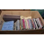 A box containing CD's and books