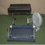 A stool, exercise bench and a fan heater
