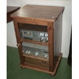 A pine hifi cabinet with glass door
