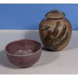 An art pottery lidded jar and an art pottery bowl