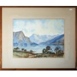 A framed watercolour depicting a mountainous lake scene