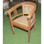 An oak framed bergere chair