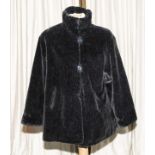 A lady's plush faux fur jacket