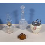A pottery biscuit barrel. decanter, oil lamp and one other