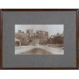 A framed Victorian drawing of Bamburgh Castle