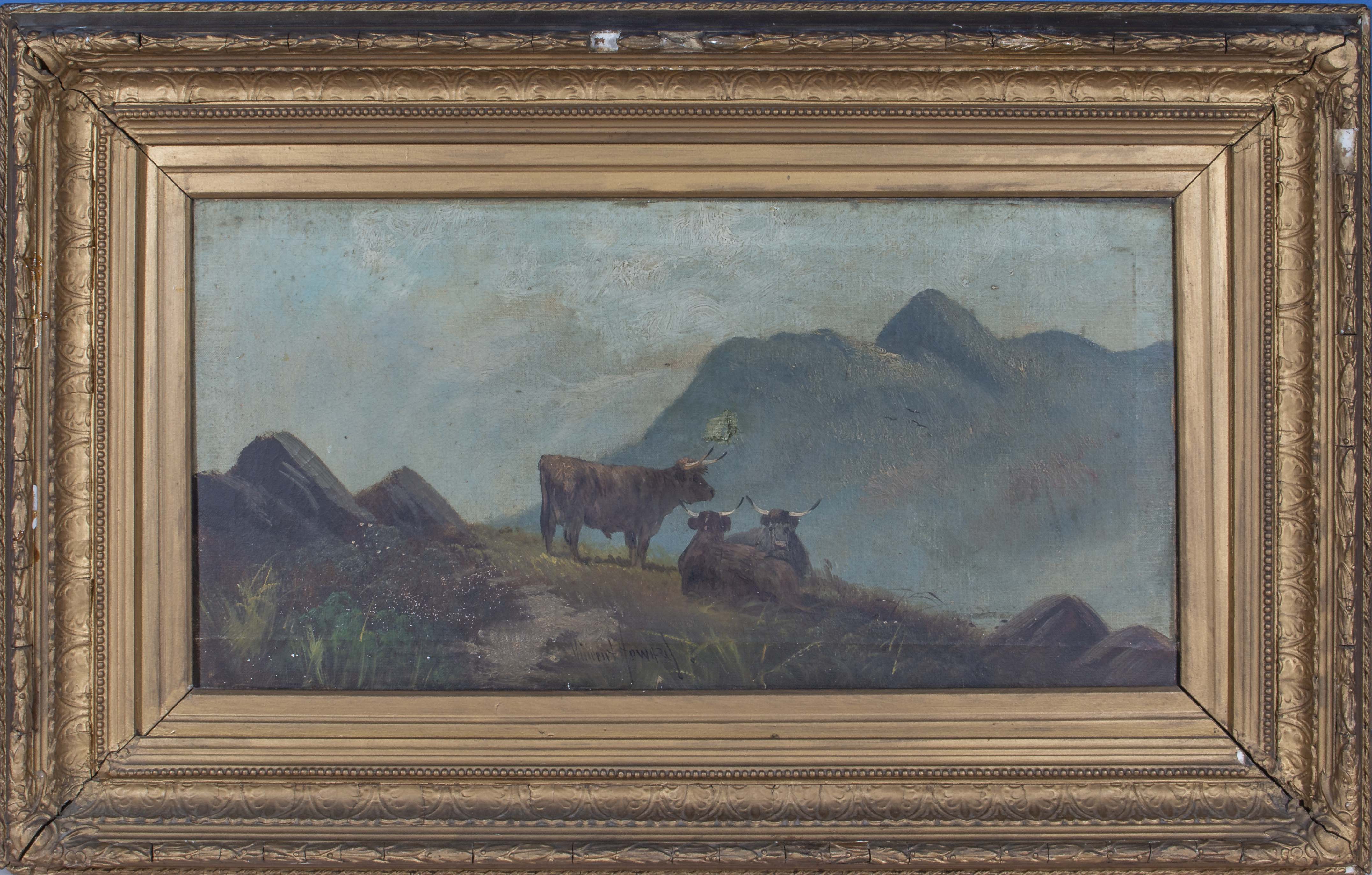 A gilt framed oil on canvas depicting Highland cows in a mountain landscape