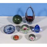 Four glass paperweights and three others