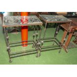 A pair of iron framed, glass topped side tables