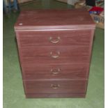 A small chest of four drawers