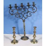 A large five branch candelabra and two small ones
