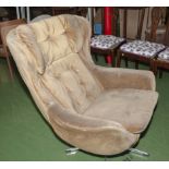 A retro egg chair, vintage swivel armchair