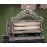 A cast iron vintage mangle