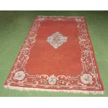A red ground wool rug