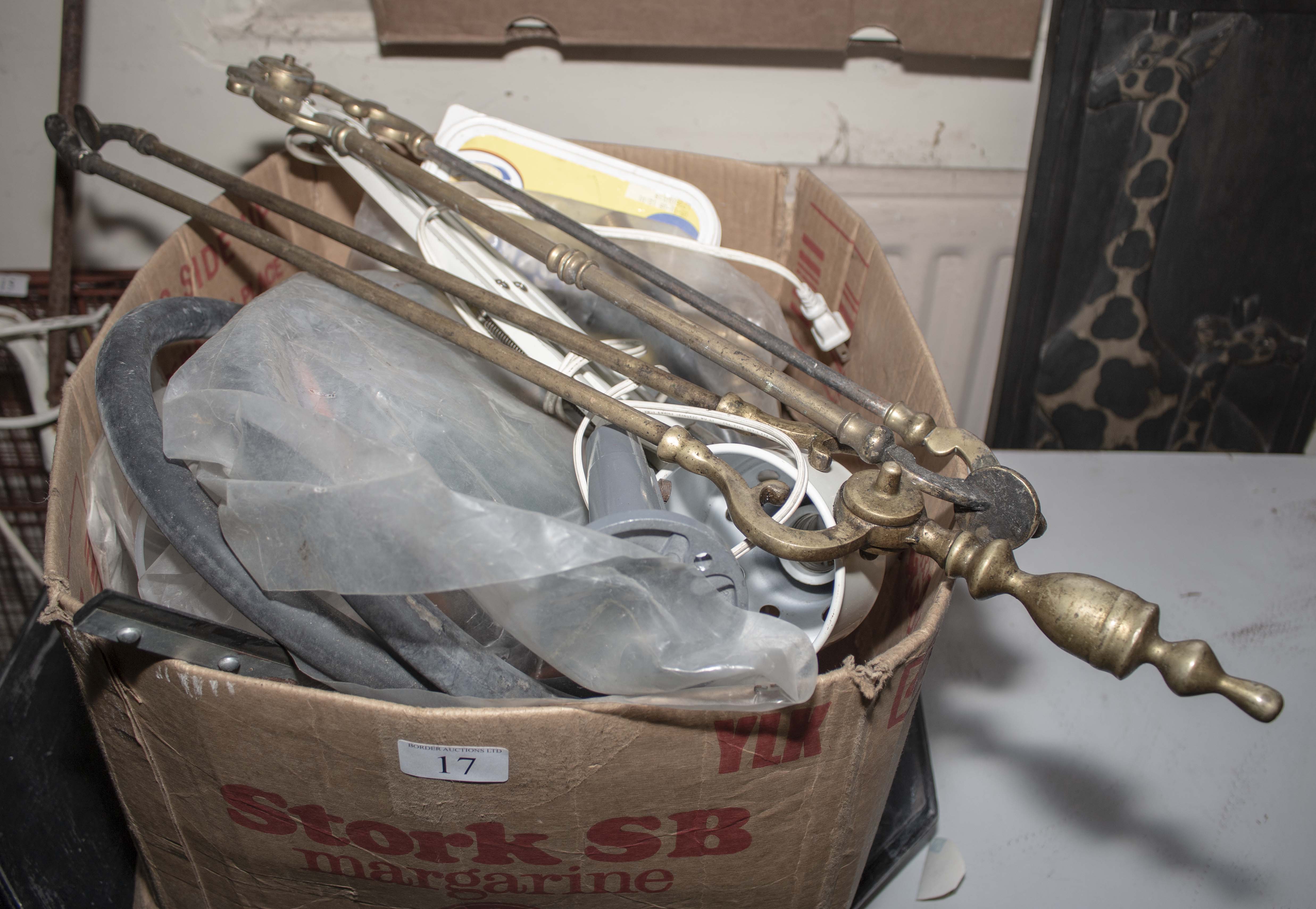 A box of assorted items including fire irons and tools