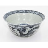 A Qing dynasty blue and white bowl with dragon design