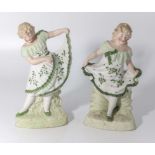 A pair of bisque figures