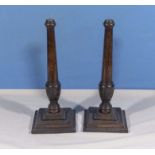 A pair of wood candlesticks