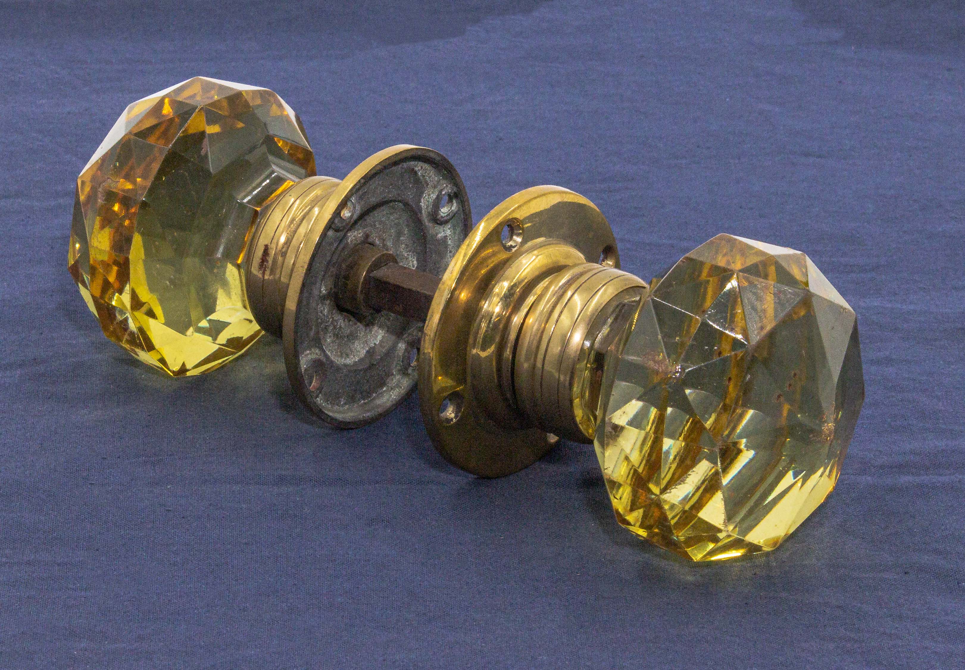 A pair of Victorian amber glass door handles