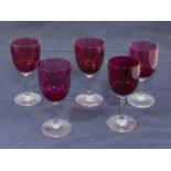 Five ruby wine glasses