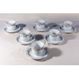 Six decorative china teacups and saucers