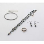 A freshwater pearl necklace set together with a Victoria Walls silver tone steel stud bangle