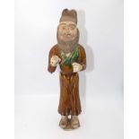 A large glazed Ming Dynasty figure of a bearded foreigner with T.L Test certificate
