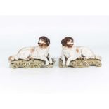 A pair of Continental bisque china dogs