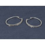 A pair of 9ct white gold diamond hoop earrings