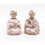 A pair of Continental bisque nodding head Oriental figures