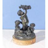 A bronze figure group on marble base depicting cherubs with baskets of fruit, 31cm tall