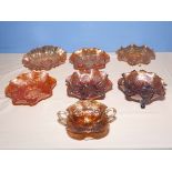 Seven ornamental carnival glass dishes