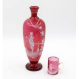 A large Victorian Mary Gregory ruby glass vase together with small ruby tankard