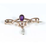 A 9ct gold brooch with a drop pearl and blue stone