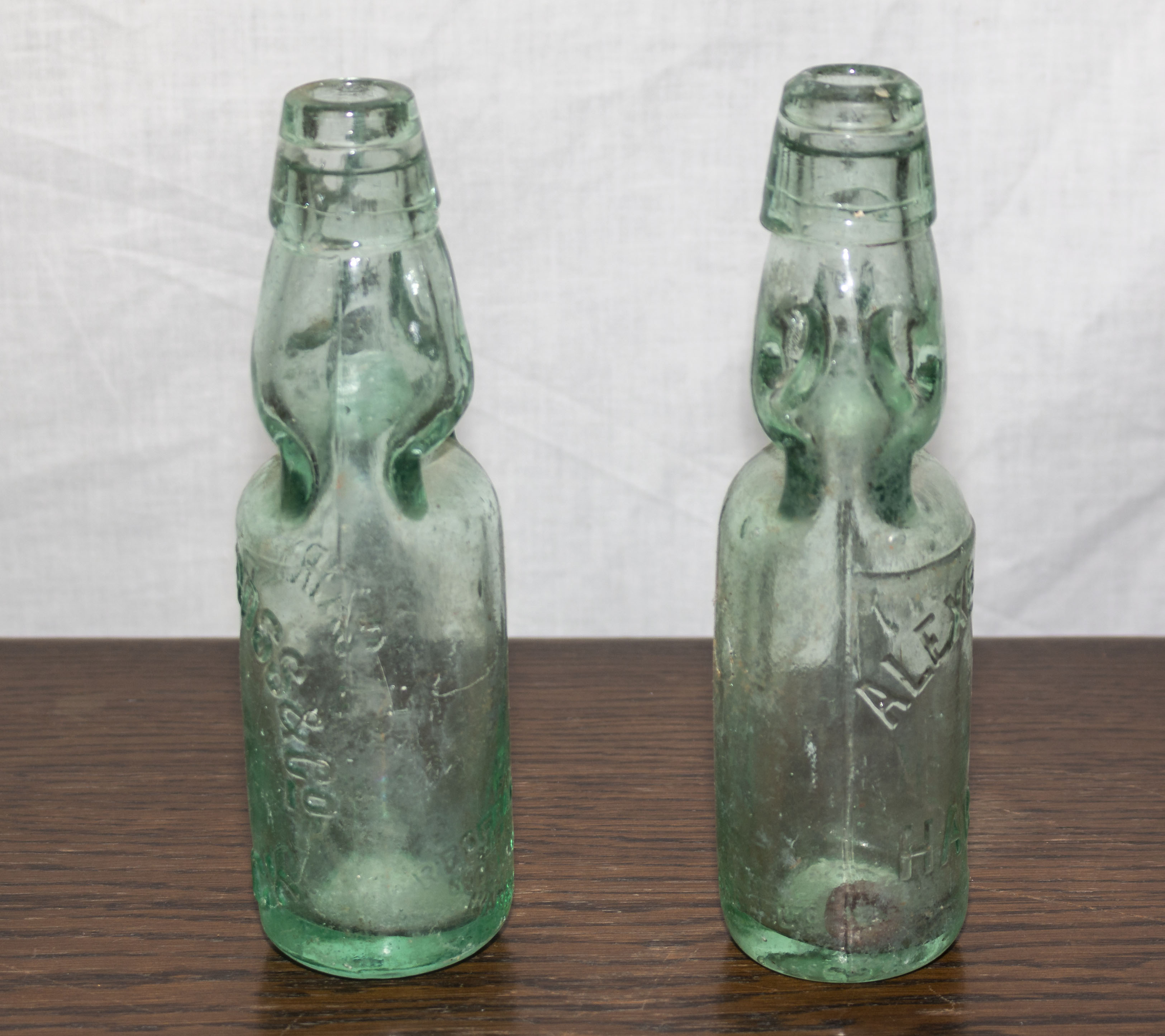 To vintage glass bottles with marble stoppers